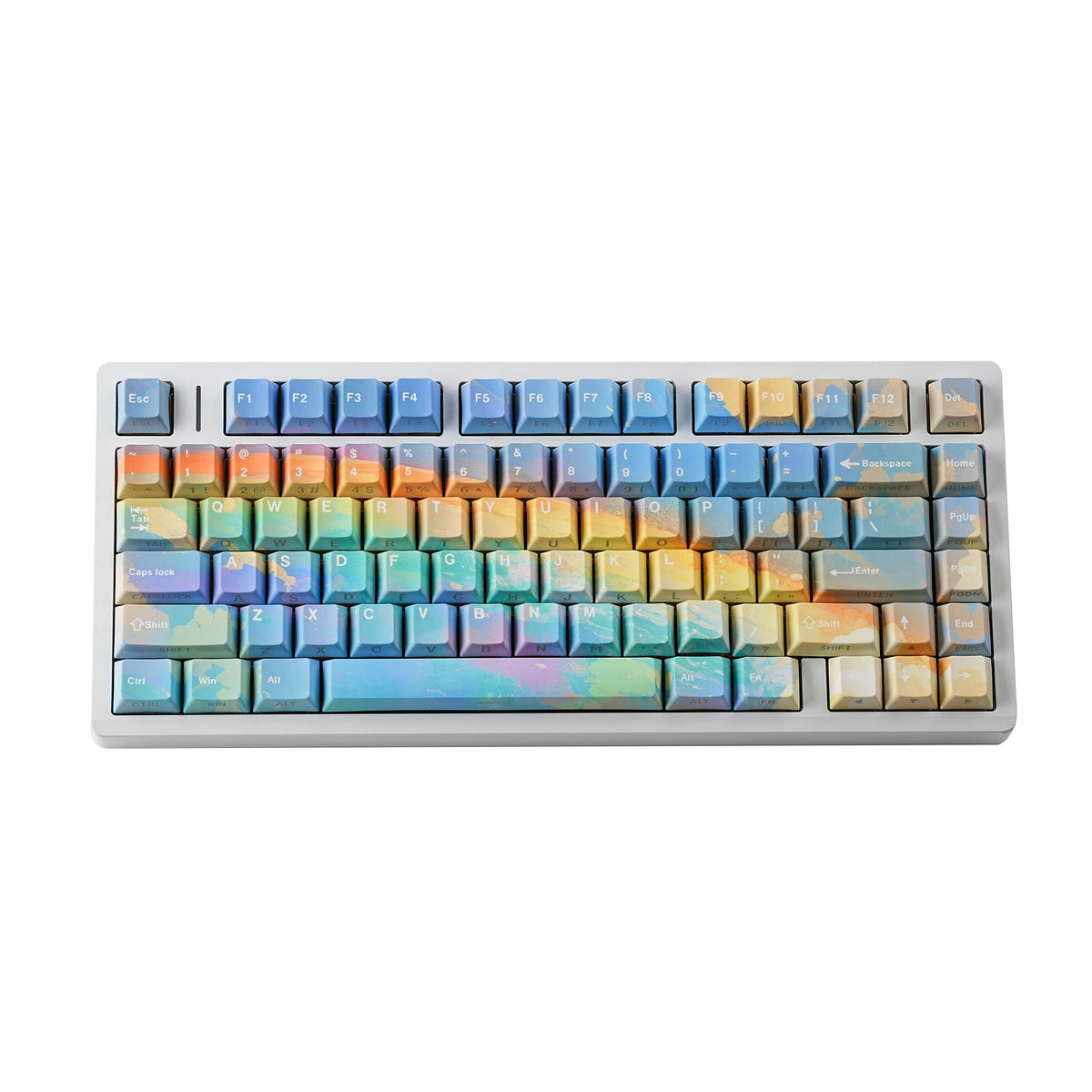 Rainbow keycap set — top-down on a clean desk