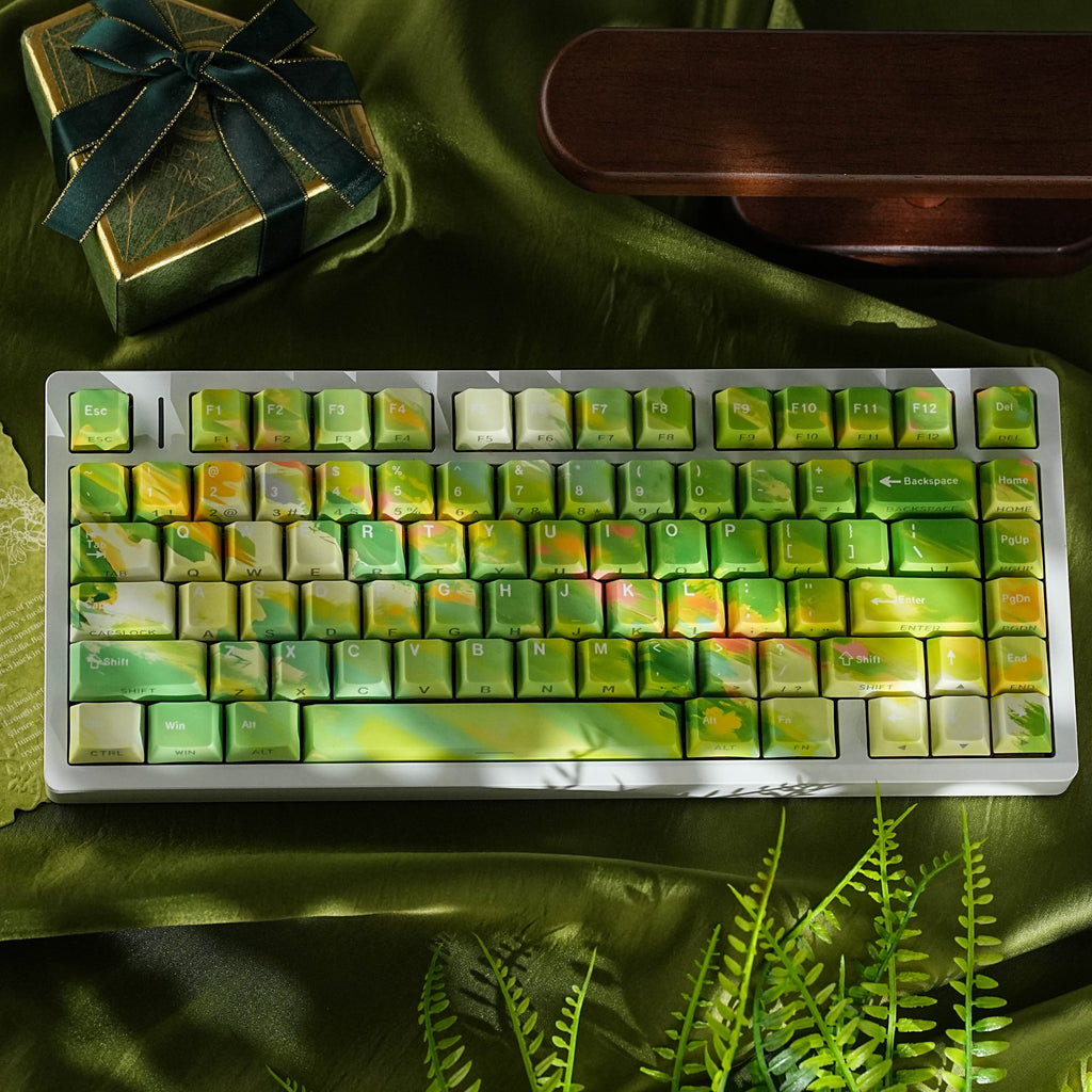 SpringMoor keycap set — top-down on green silk